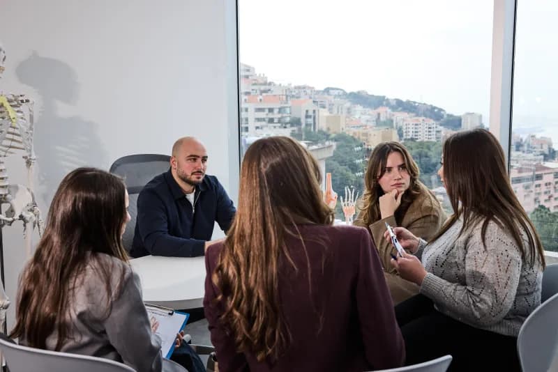 Synergy Clinic team collaborating in a multidisciplinary meeting